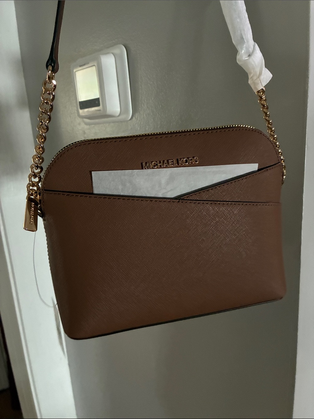 Michael Kors NWT all original packaging… sleek beautiful purse.Large strap with!